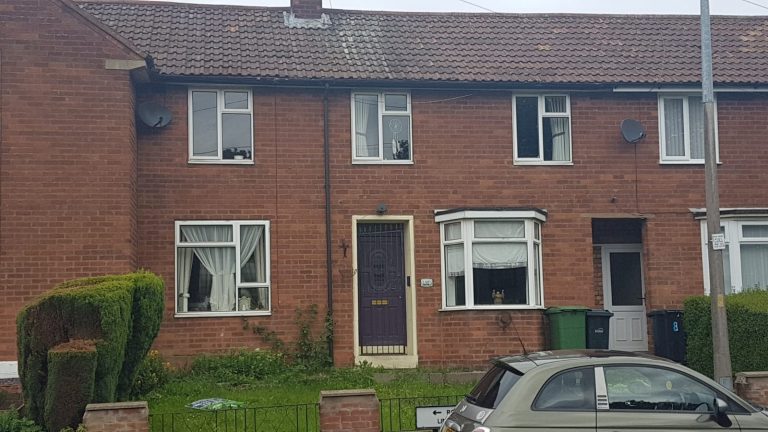 Property before new uPVC windows, composite door and entrance canopy were installed