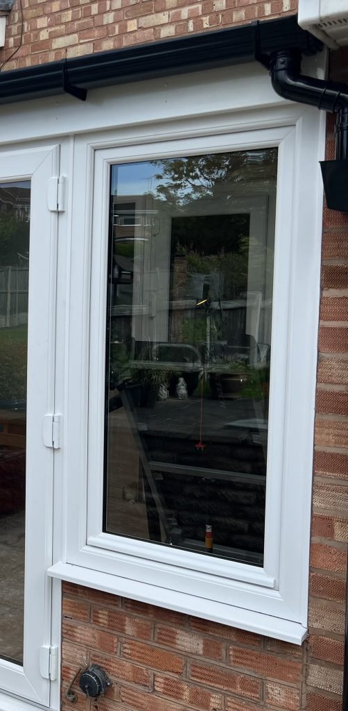White uPVC tilt and turn window opened inward