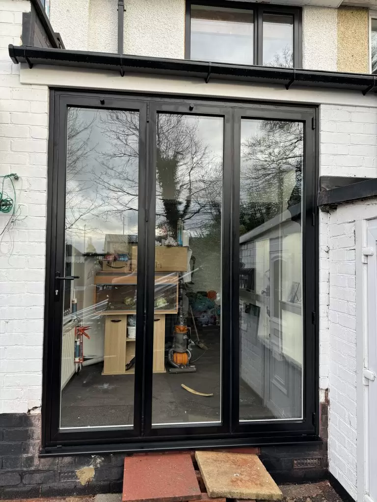 Finished black aluminium bifold doors fitted by uPVC Houselift in Wolverhampton