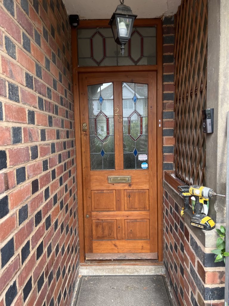 Entrance before a Chartwell green uPVC door was installed by uPVC Houselift
