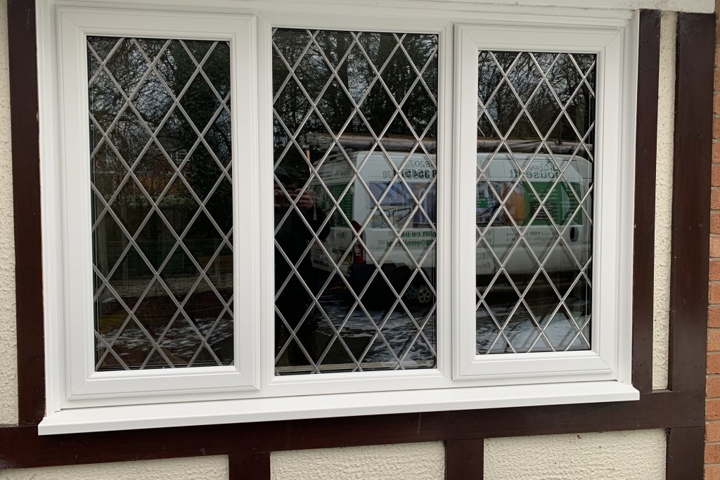 White REHAU uPVC window with decorative leaded glass installed by uPVC Houselift in Perton near Cheslyn Hay.