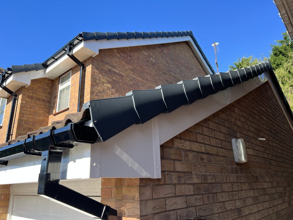 After uPVC Houselift installed upvc fascia, soffit, black guttering and grey dry verge caps