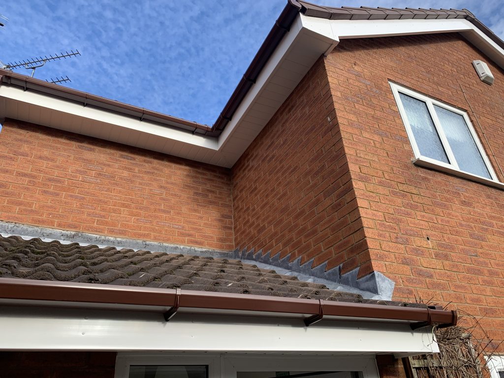 New white uPVC fascias, soffits and brown guttering installed by uPVC Houselift in Perton