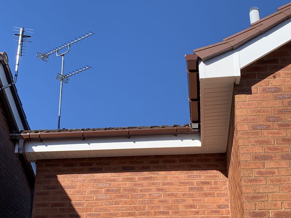 New white uPVC fascias, vented soffits and brown guttering installed by uPVC Houselift in Perton