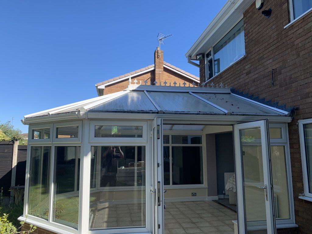 Old polycarbonate conservatory roof before replacement