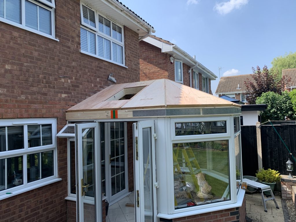 Warm Roof timber roof structure under construction on existing conservatory