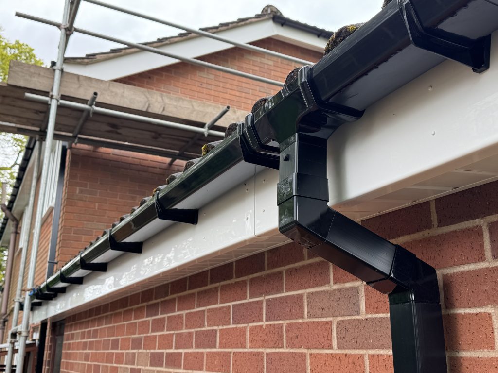 white fascia, soffits and black guttering by upvc houselift