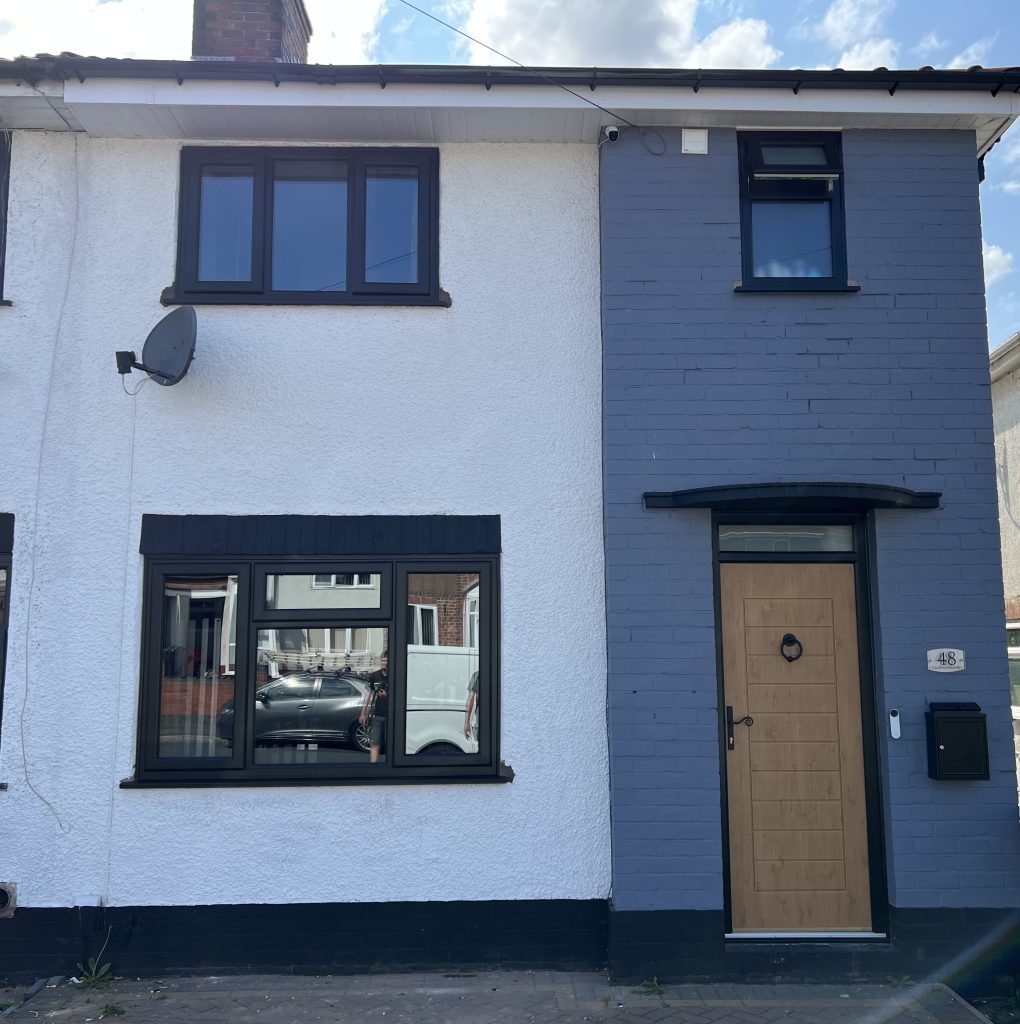 Black Rehau uPVC Windows with a Irish oak Composite door supplied and installed by uPVC Houselift