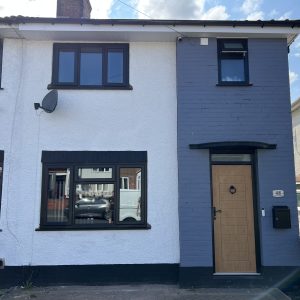 Black Rehau uPVC Windows with a Irish oak Composite door supplied and installed by uPVC Houselift