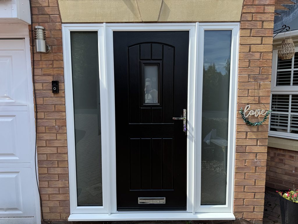 Black Rockdoor composite front door with white side frames installed in Highfields Park, Cheslyn Hay by uPVC Houselift