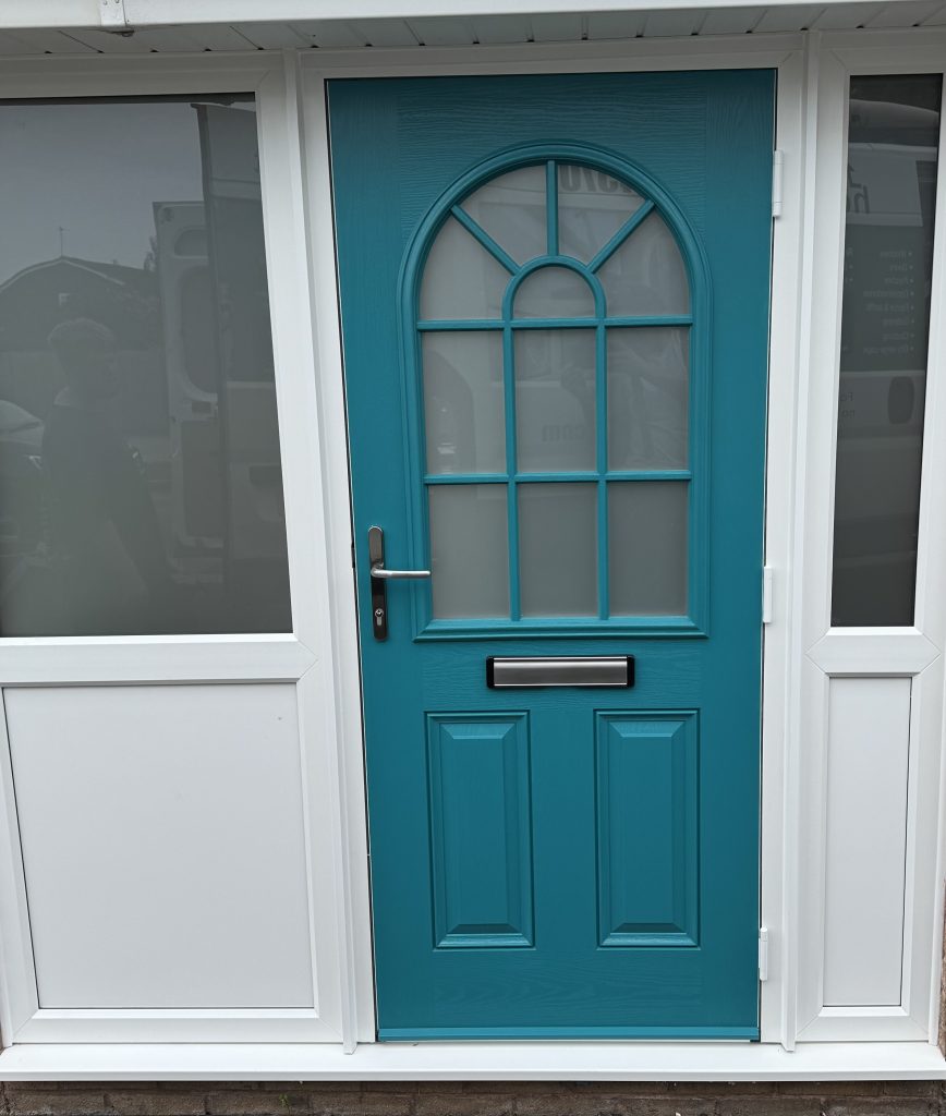 Teal composite entrance door installed in Perton
